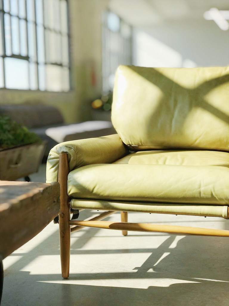 A comfortable lounge chair in a bright coastal interior